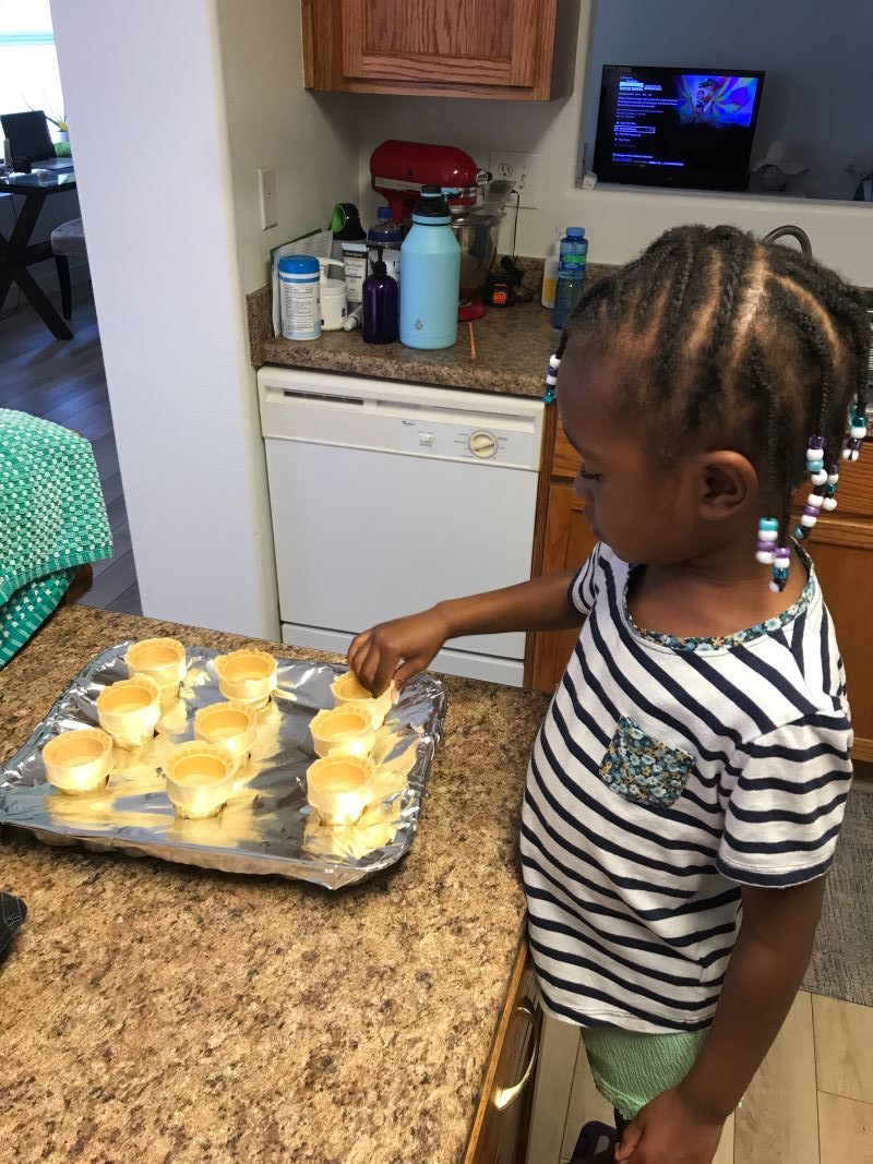 Noelle setting up the baking pans