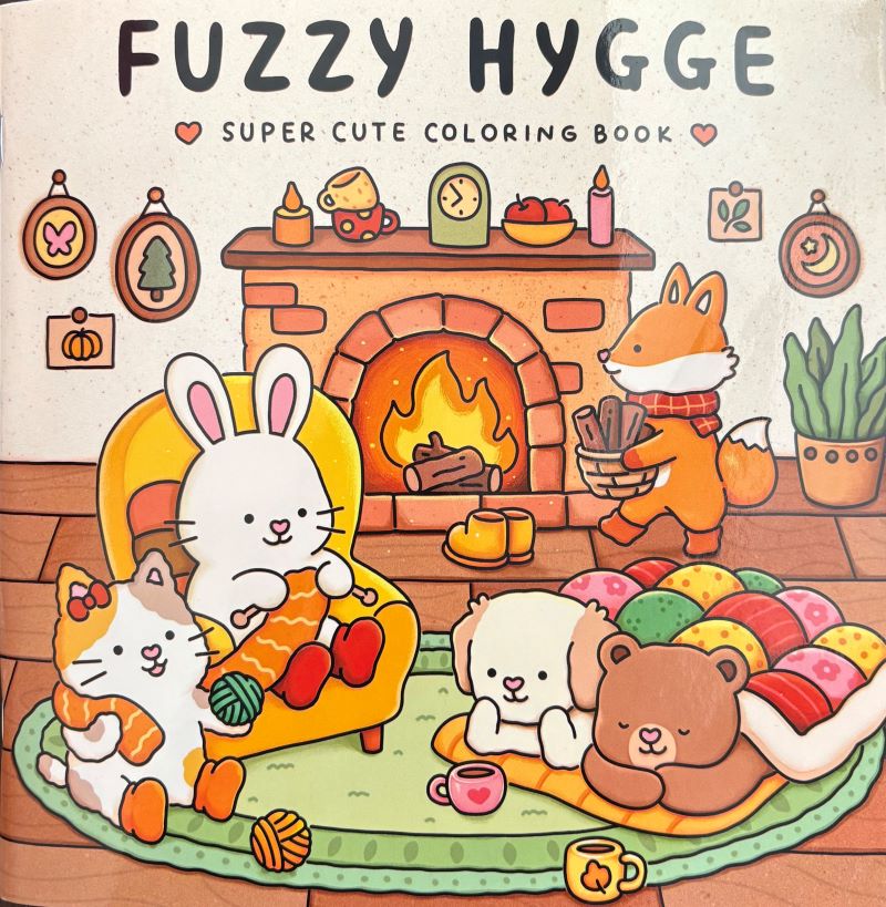 Cover of the "Fuzzy Hygge Super Cute Coloring Book" featuring a cozy scene with a bunny, cat, bear, and fox relaxing by a fireplace with warm decorations and a colorful blanket.